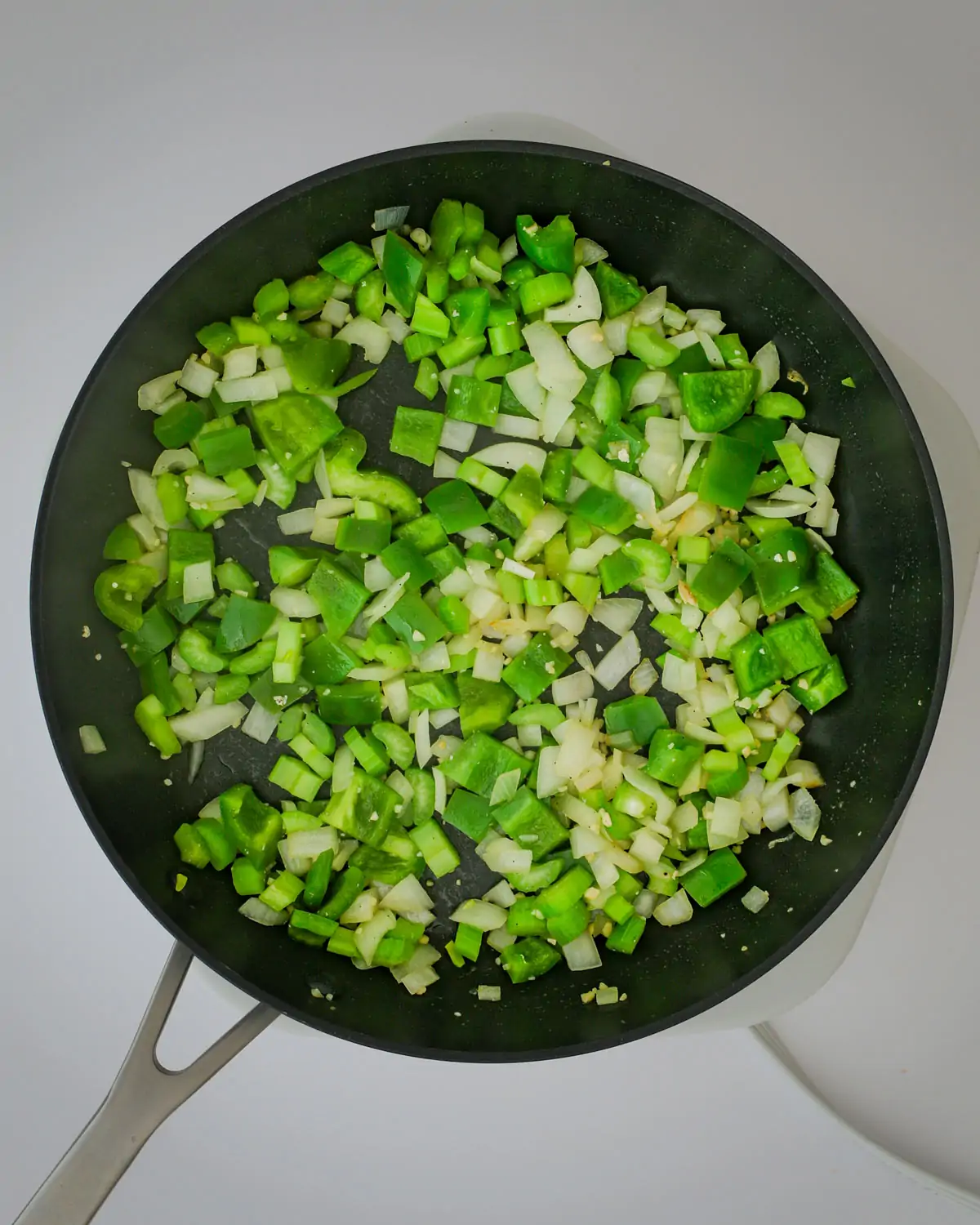 peppers, onions, and celery in skillet. 