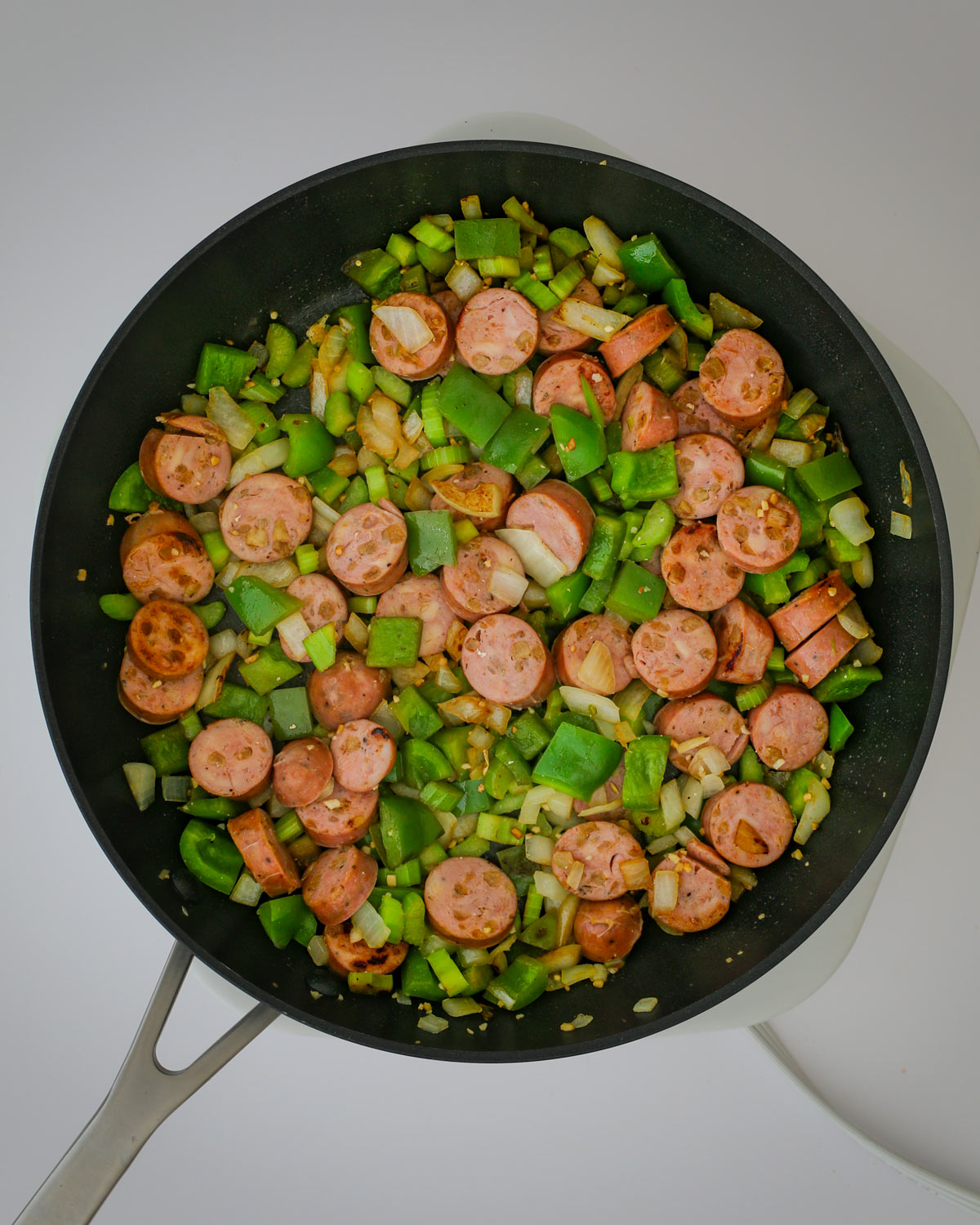 sausage added to the skillet.