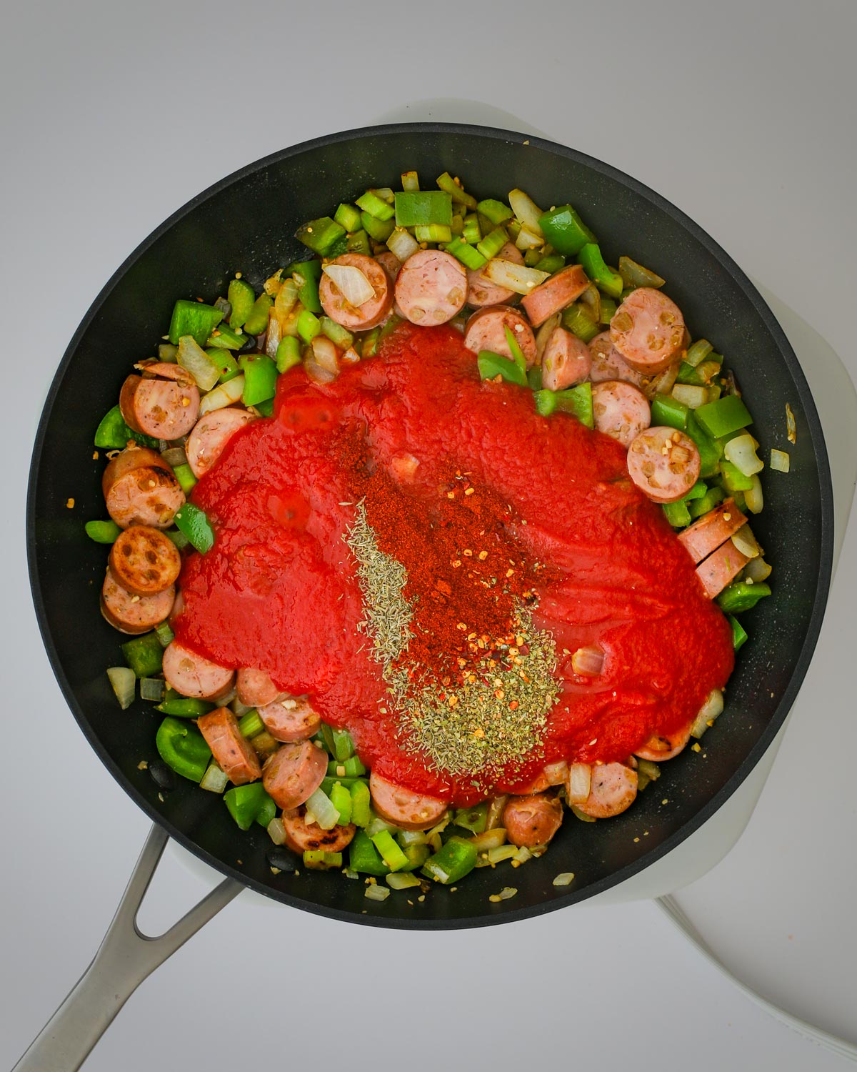 sauce and spices added to the skillet.