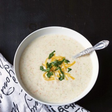 A bowl of Cauliflower soup, with cheese