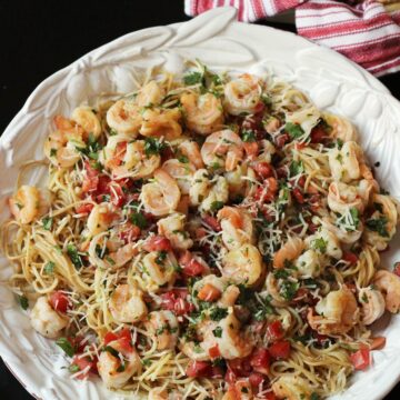 close up of cilantro shrimp pasta in large pasta bowl.