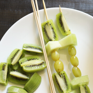 green fruit kabobs on plate