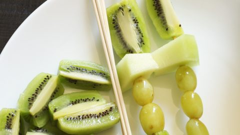 green fruit kabobs on plate