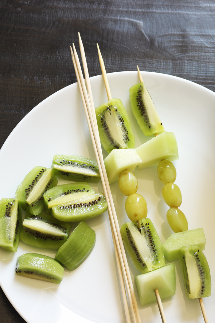 green fruit kabobs on plate