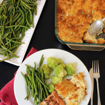 Cheesy Potatoes green beans and dinner plate with fish