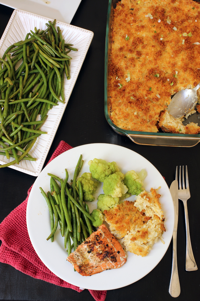 Cheesy Potatoes green beans and dinner plate with fish