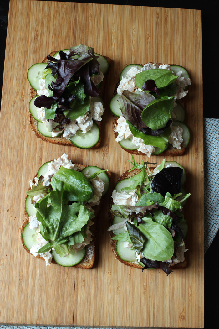 array of sandwiches with chicken salad and greens