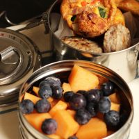 tiffin box with fruit and egg muffins