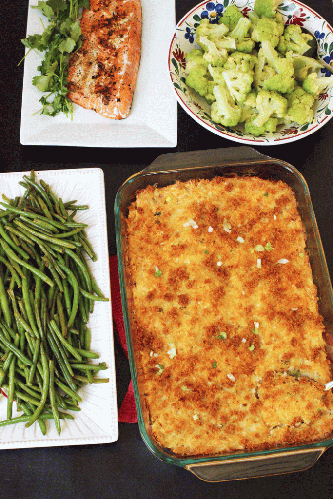 casserole dish next to bowls of vegetables