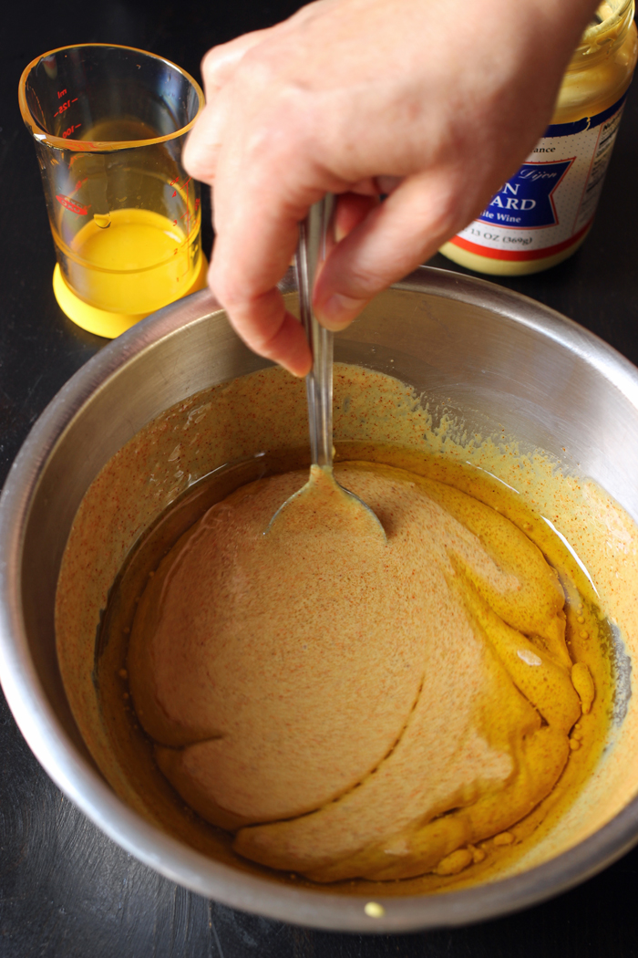 stirring marinade in bowl