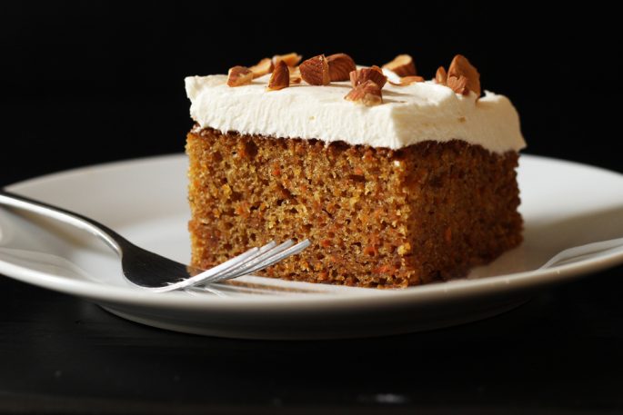 A piece of carrot cake on a plate