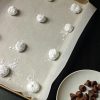 tray of cookie balls rolled in powdered sugar