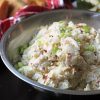 A metal bowl of potato salad