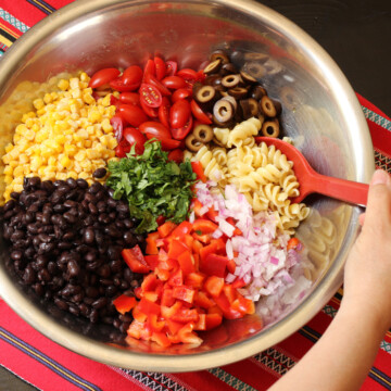 A bowl of pasta, black beans, and vegetables