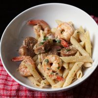 fork and bowl with creamy jambalaya pasta