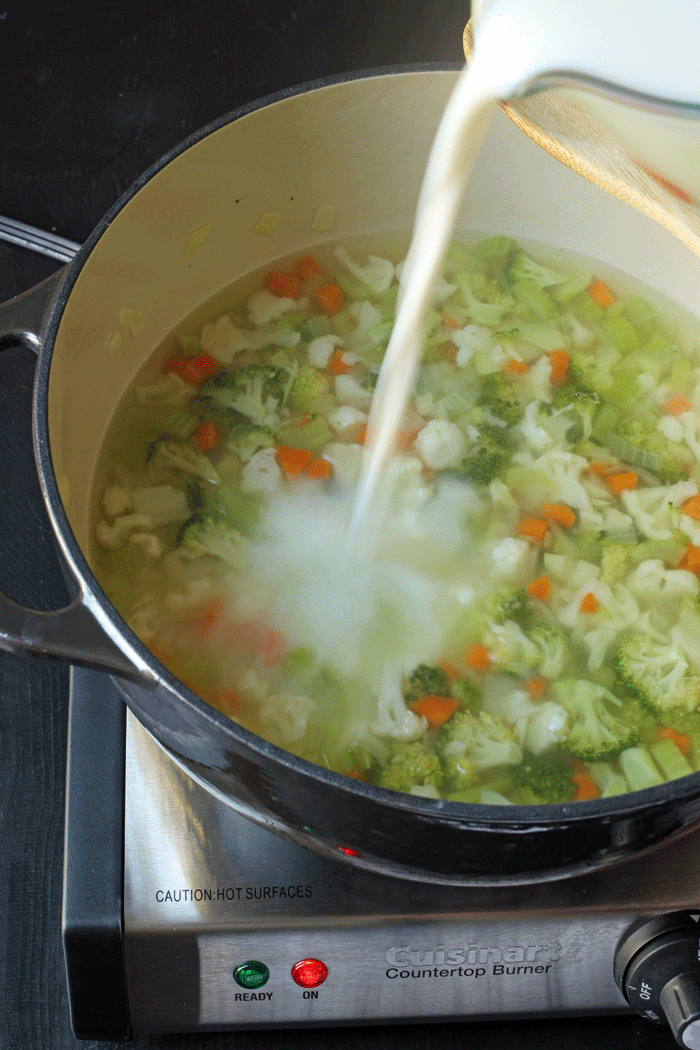 a pot of soup, with milk
