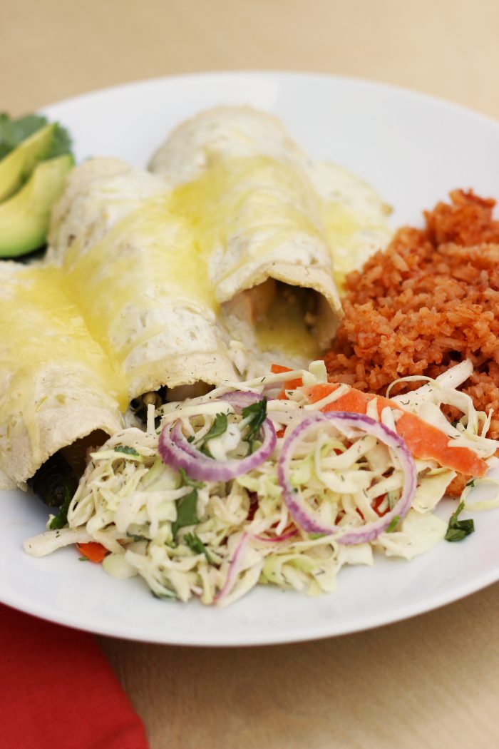 A plate of Poblano enchiladas with sides