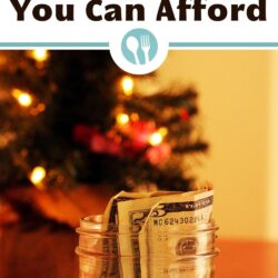 close up of jar of money in front of mini christmas tree with text overlay: How to Plan Holiday Meals You Can Afford.
