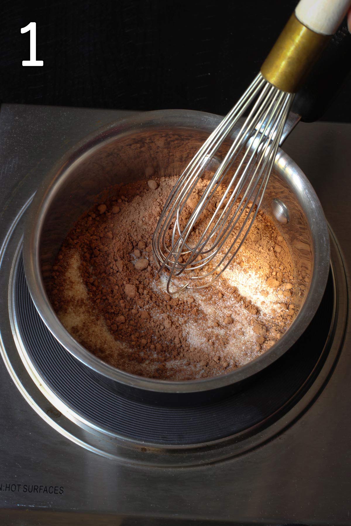 whisking together the dry ingredients in a medium saucepan on the burner.