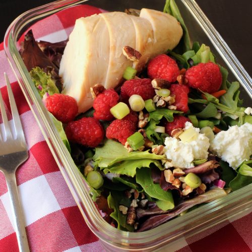 A tray of food on a table, with Raspberry Chicken Salad