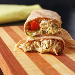 cut burrito halves stacked on cutting board