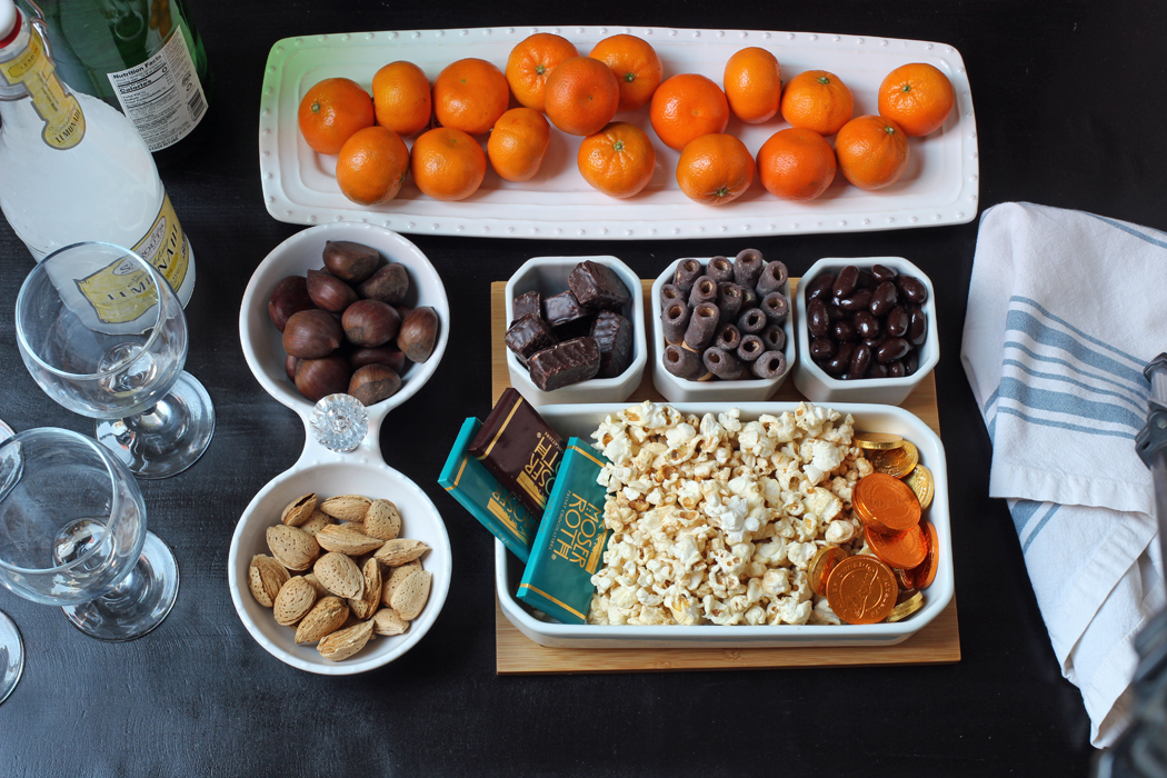 dessert table with fruit nuts chocolate and popcorn