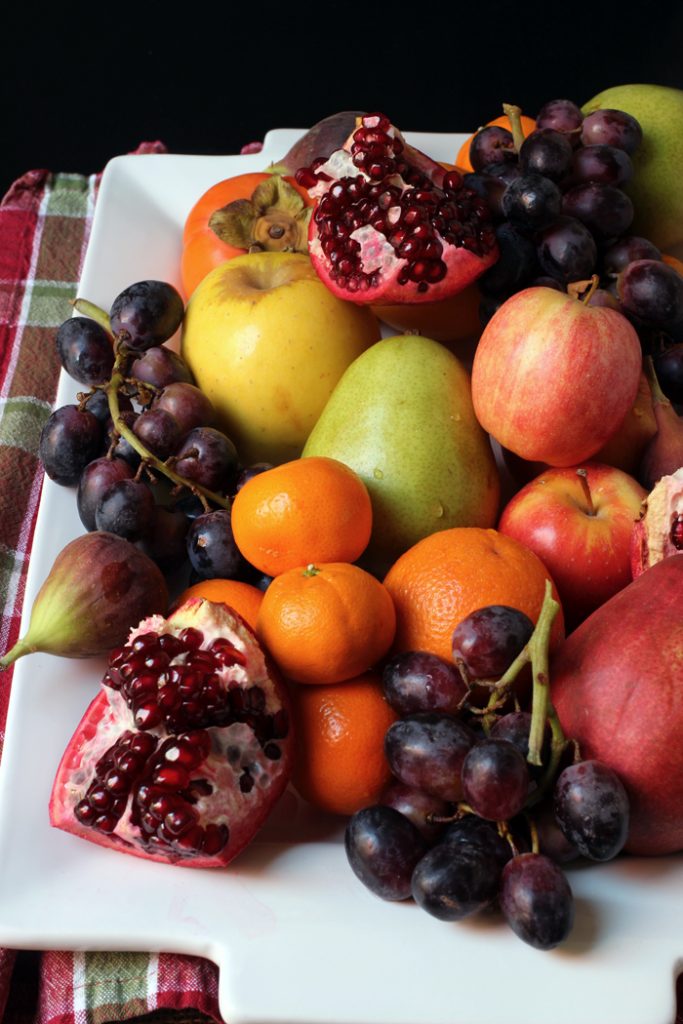 pile of winter fruit on a platter