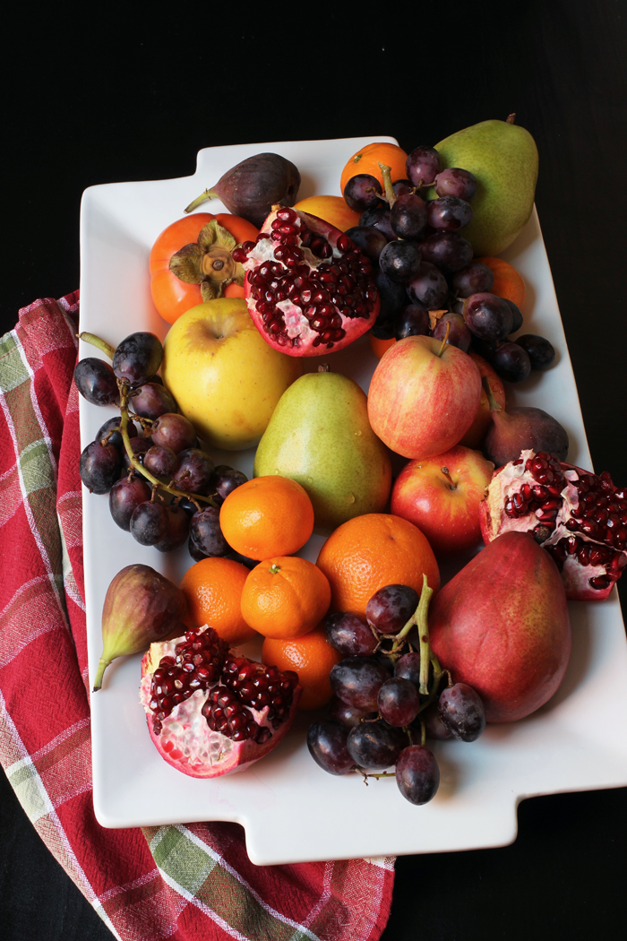 A plate of fruit sitting on a table