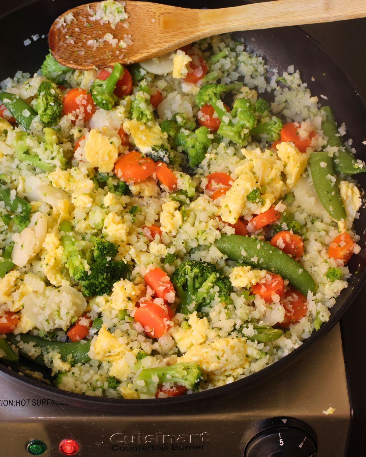 the finished cauliflower stir fry in the skillet.