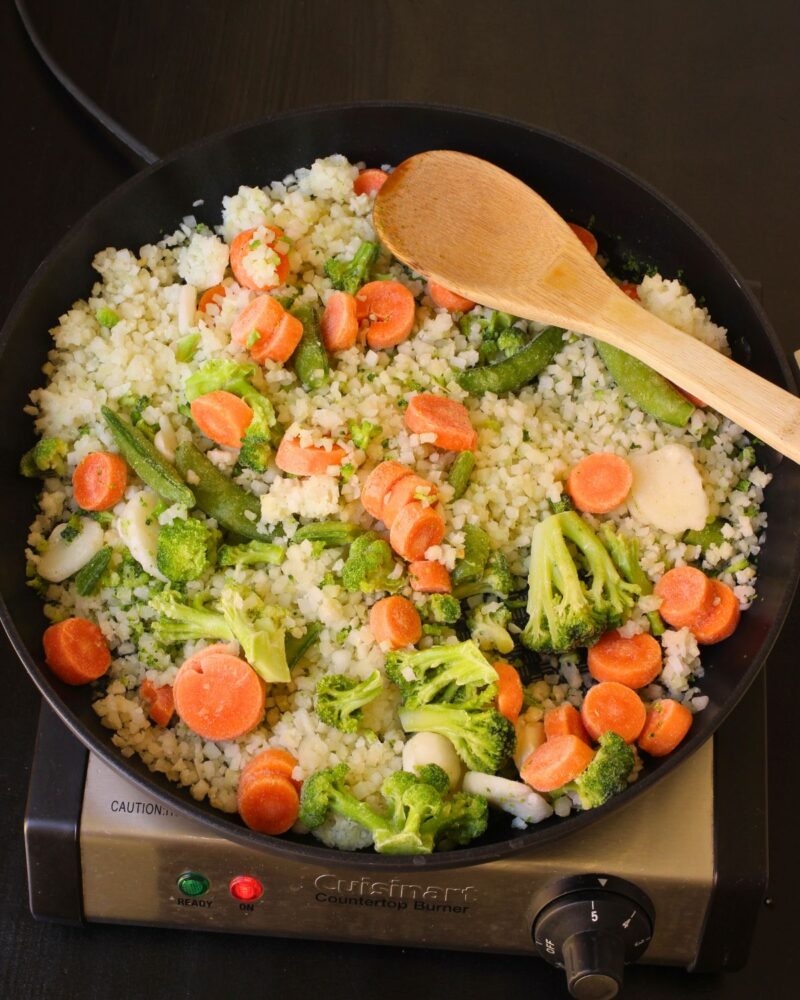 cooking all veggies in the skillet.