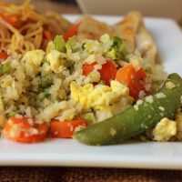 plate of cauliflower fried rice and chow mein