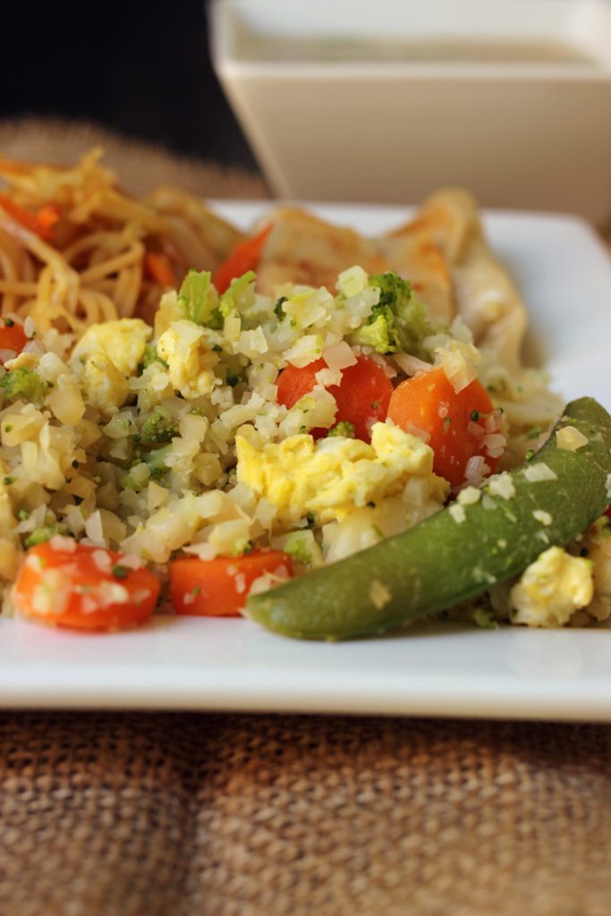 plate of cauliflower fried rice and chow mein