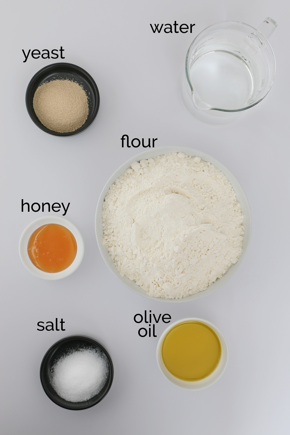 pizza dough ingredients on a white table.