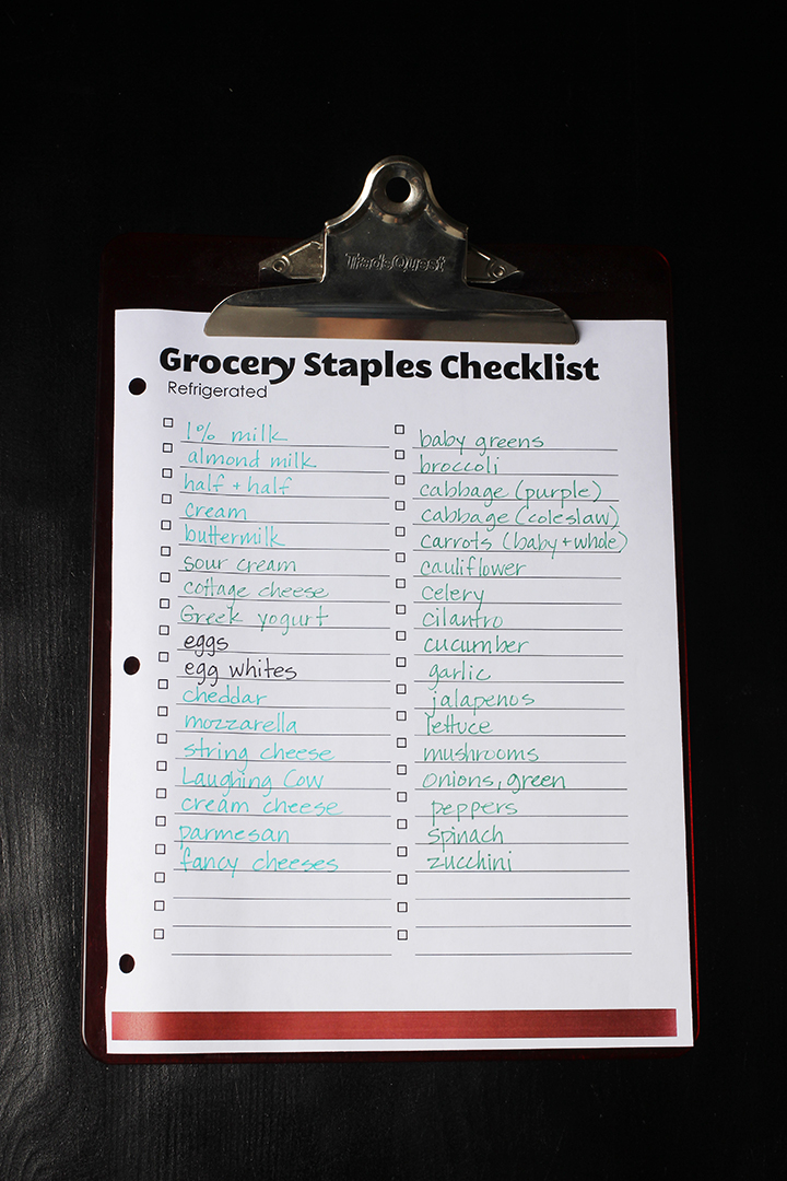 grocery staples checklist on a red clipboard