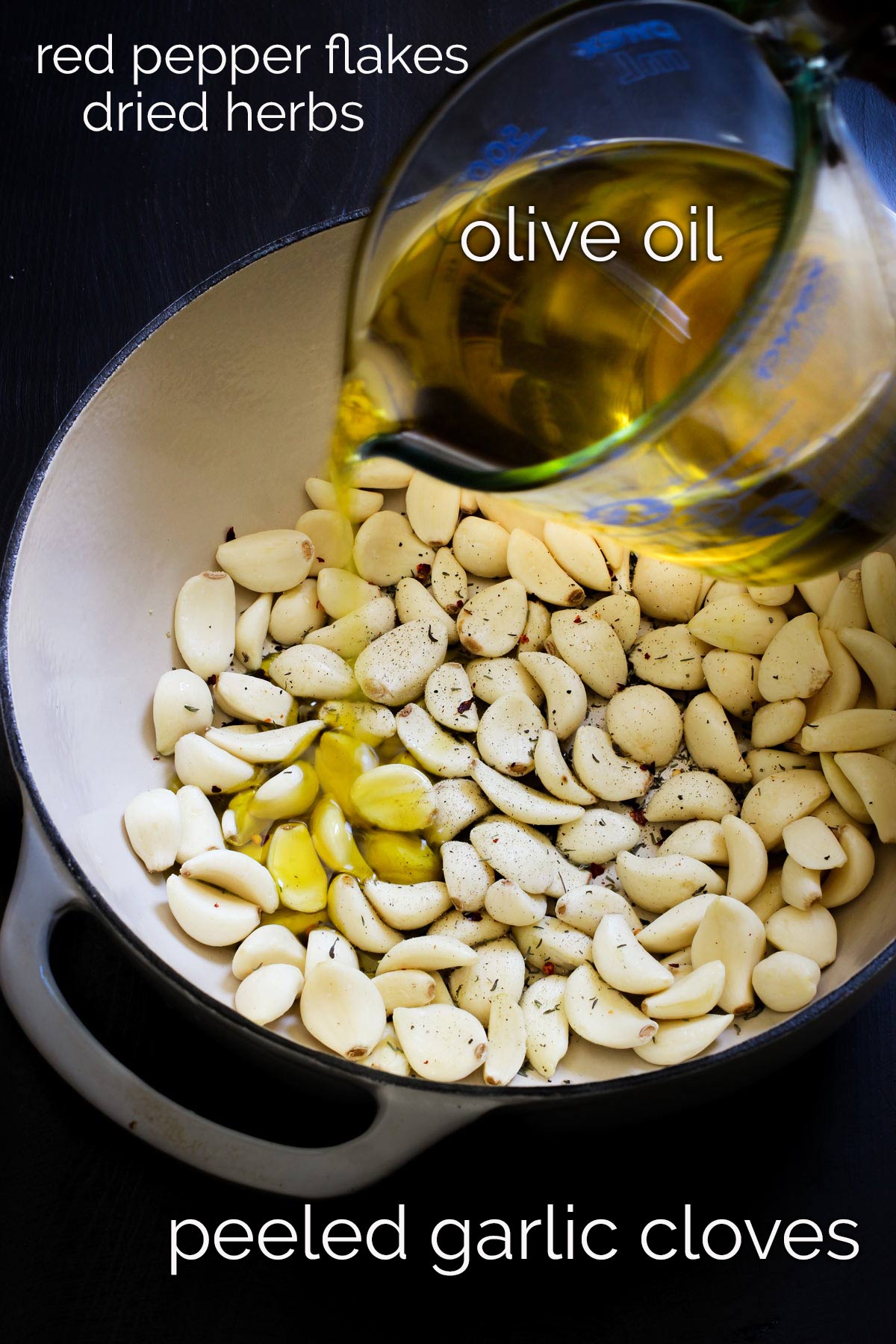 ingredients for roasted garlic on black table.