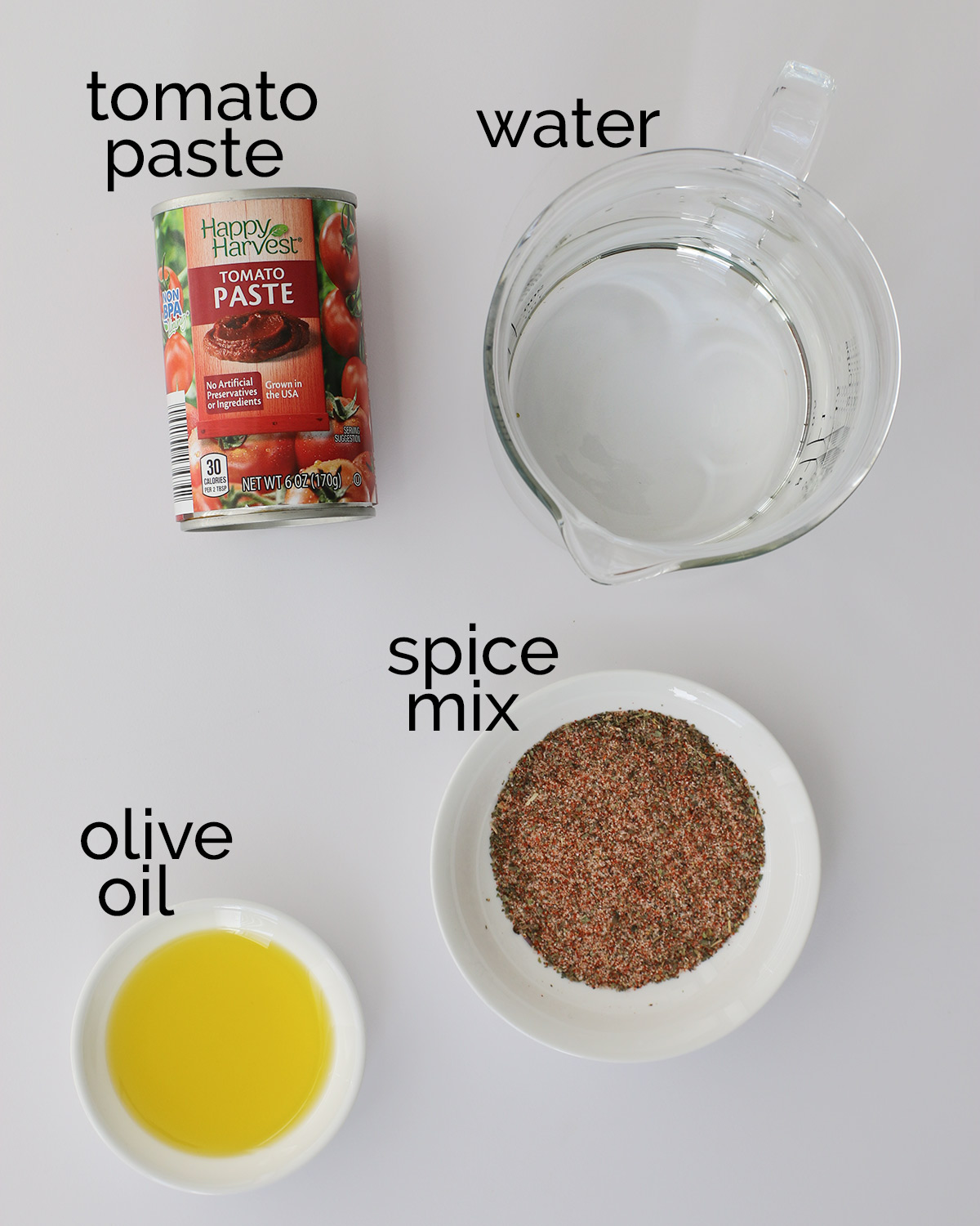 ingredients for pizza sauce, including can of tomato paste.