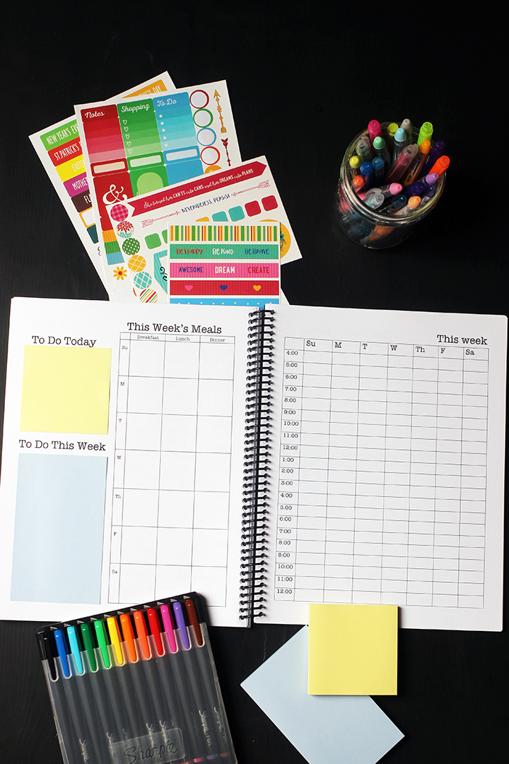 weekly pages of planner with stickers and markers