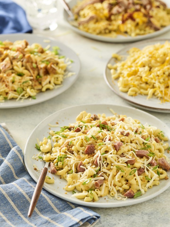 array of plates of mac and cheese from noodles and company