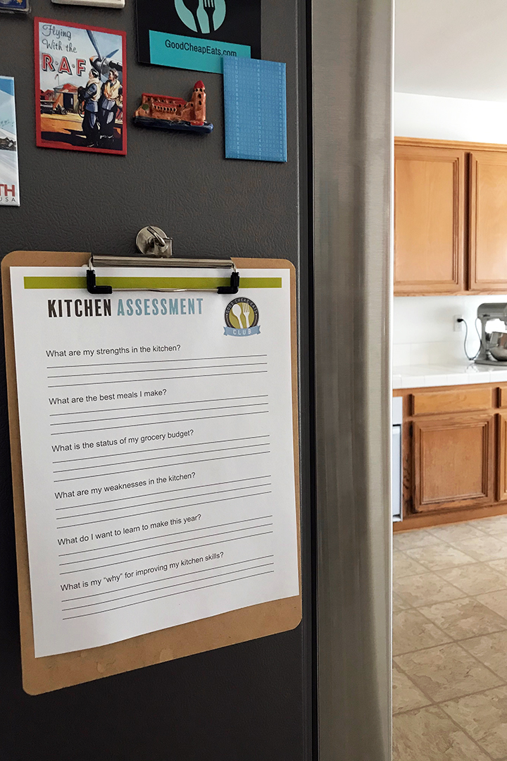 kitchen assessment worksheet on clipboard on side of fridge