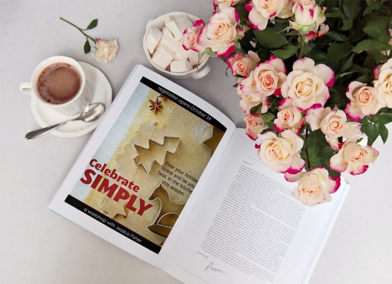 celebrate simply book on table with espresso cup, spoon, and flowers