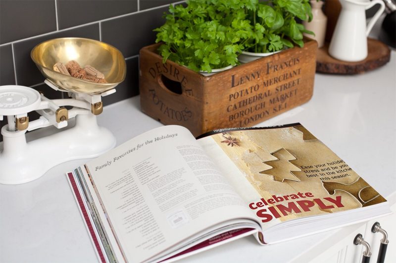 celebrate simply book open on kitchen counter