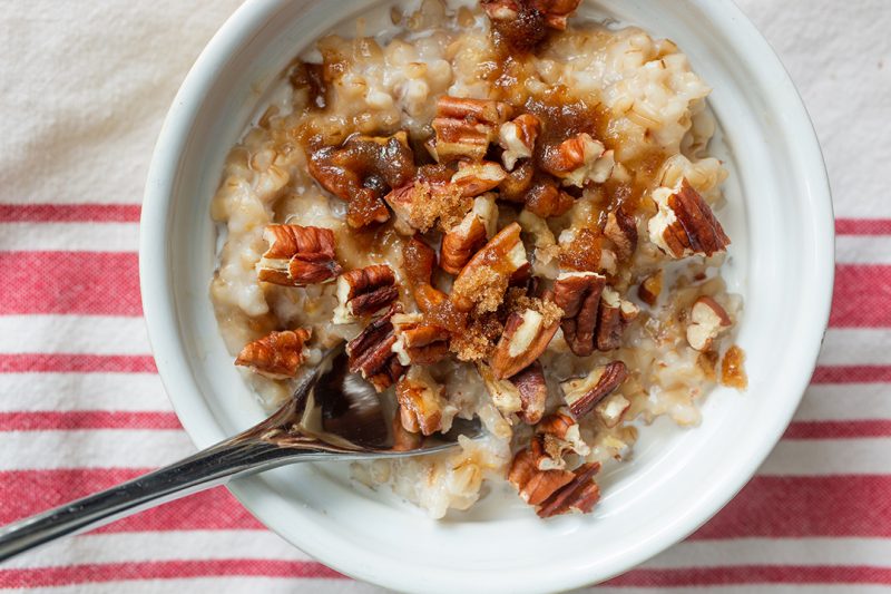 bowl of oats with spoon and red striped napkin