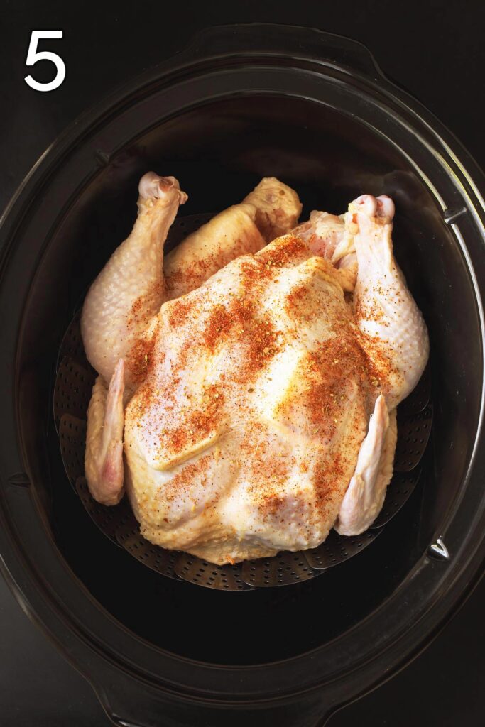 the chicken with the butter pats under the skin placed atop the steamer basket.