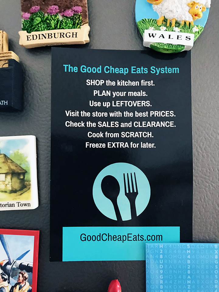 printed card of GCE system on refrigerator with magnets