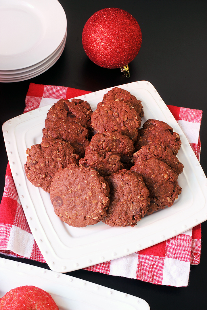white tray of chocolate oatmeal cookies on red checked napkin