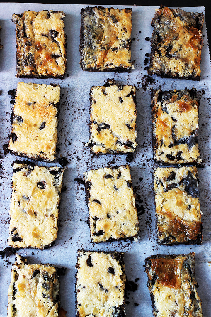 Did You Know There are Over 6,561 Ways to Make Magic Bars?! | Good Cheap Eats array of sliced double chocolate magic bars on parchment paper