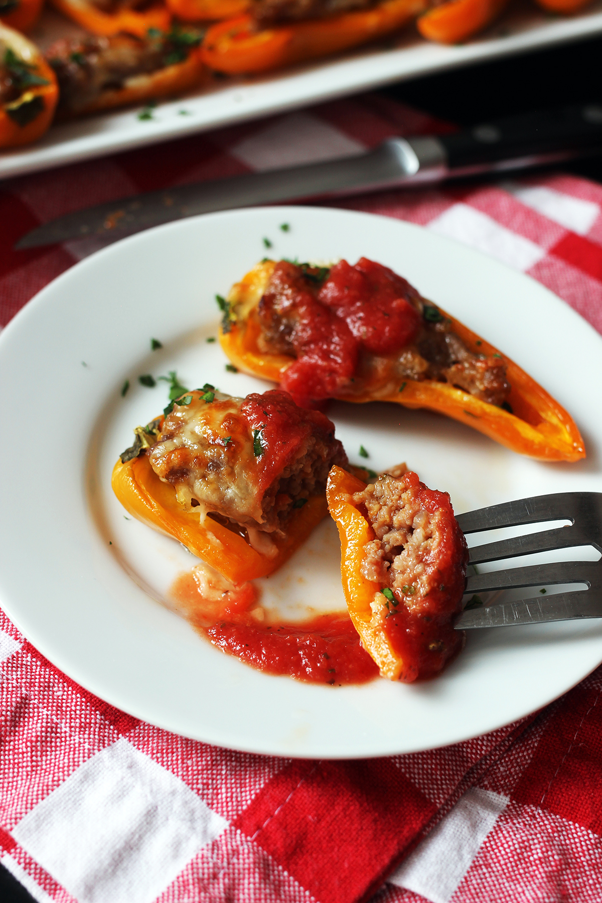 sausage pepper on plate and bite on fork