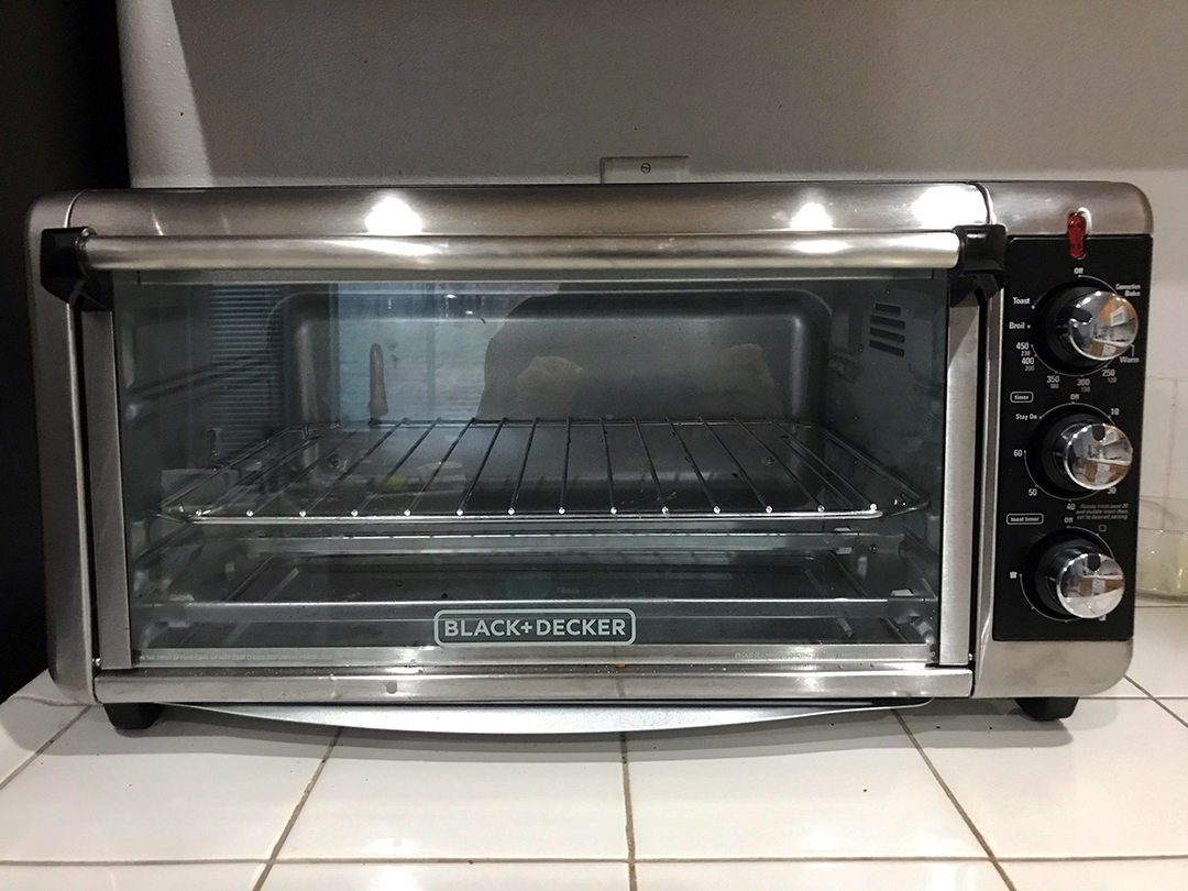 silver toaster oven on white countertop