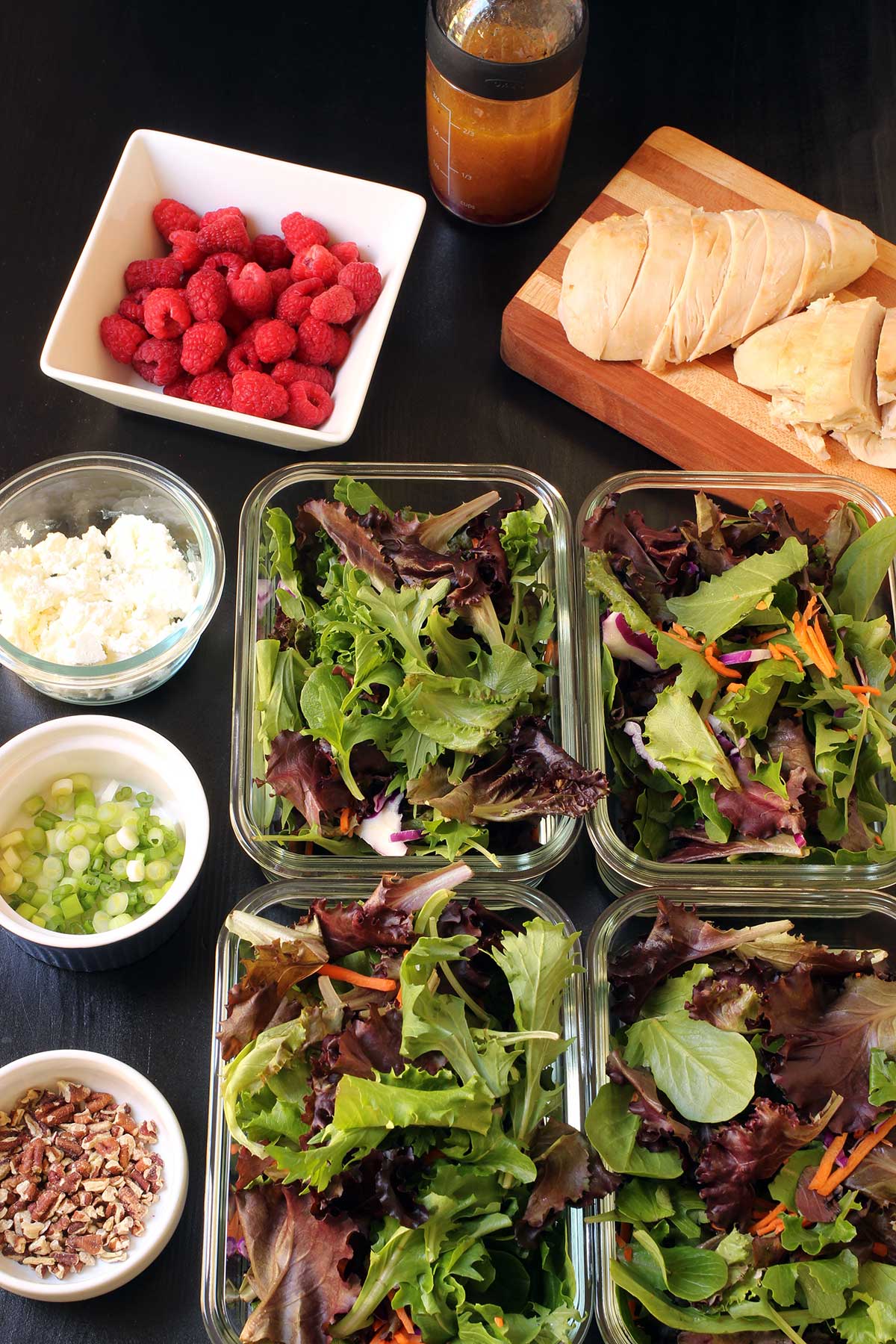 assembling raspberry salads in boxes