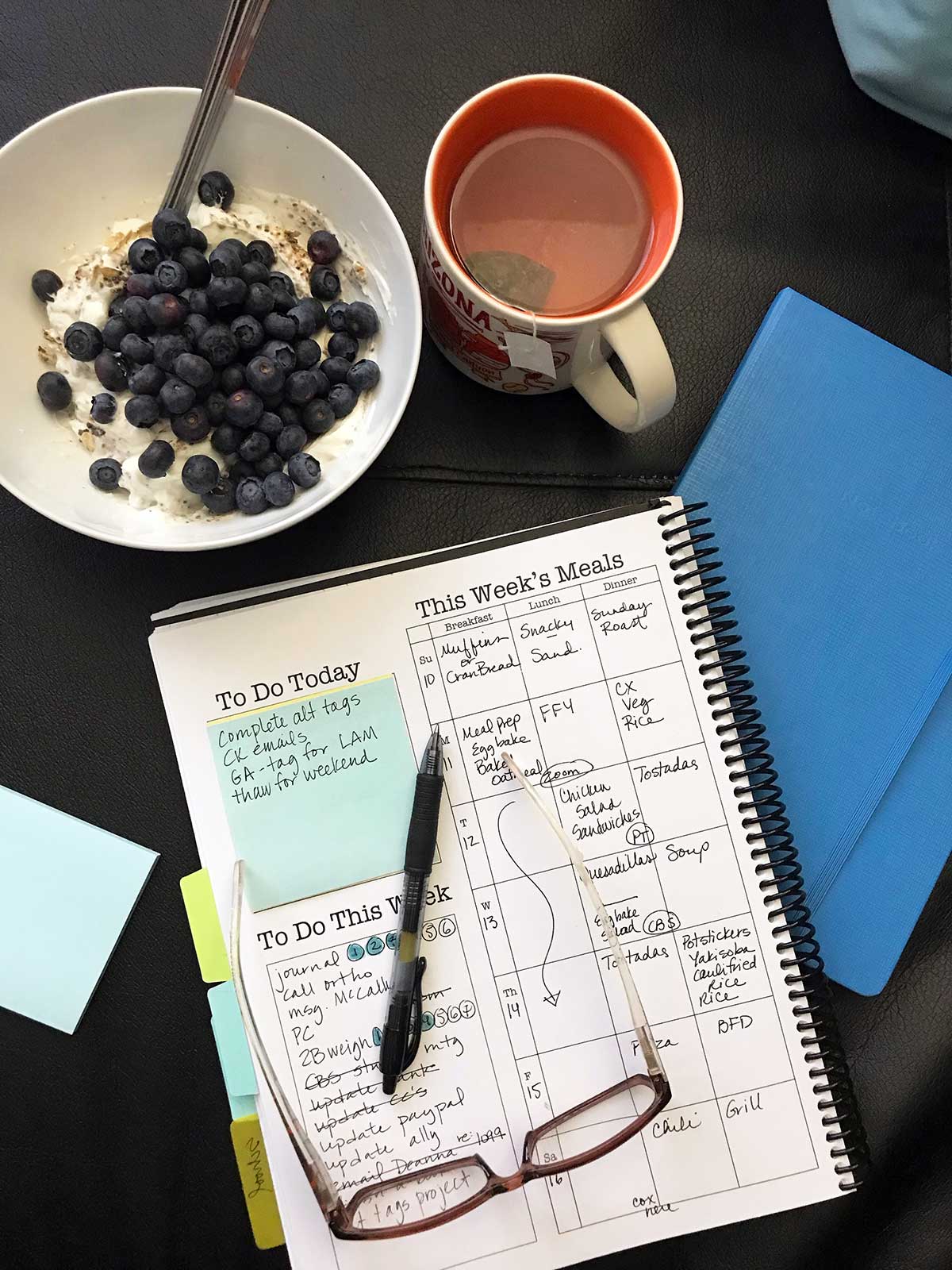 meal plan written in planner with mug and bowl